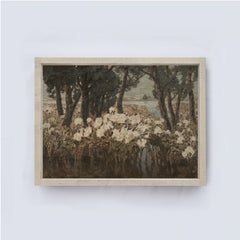Framed artwork of a landscape with trees and flowers on a white wall