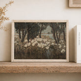 Framed artwork of a landscape with trees and flowers on a wooden shelf.