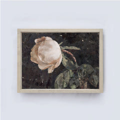 Framed artwork of a rose on a white wall