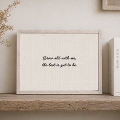 Rustic white wood coloured frame with the text in a whimsical handwritten font "grow old with me the best is yet to be"