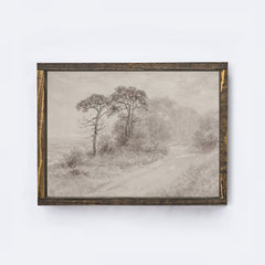 Framed artwork of a landscape with trees on a wooden shelf against a white wall.