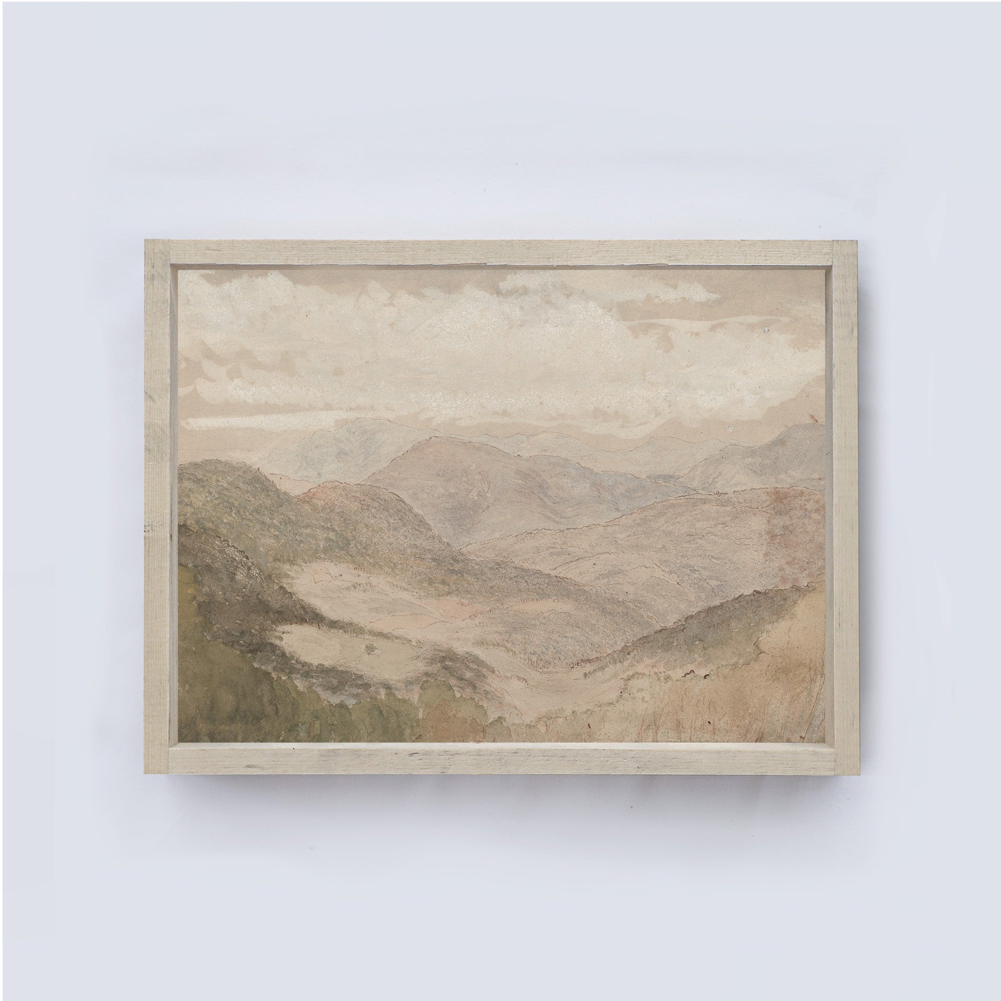 Framed soft mountain landscape painting on a white wall framed in a soft off white coloured wood frame.