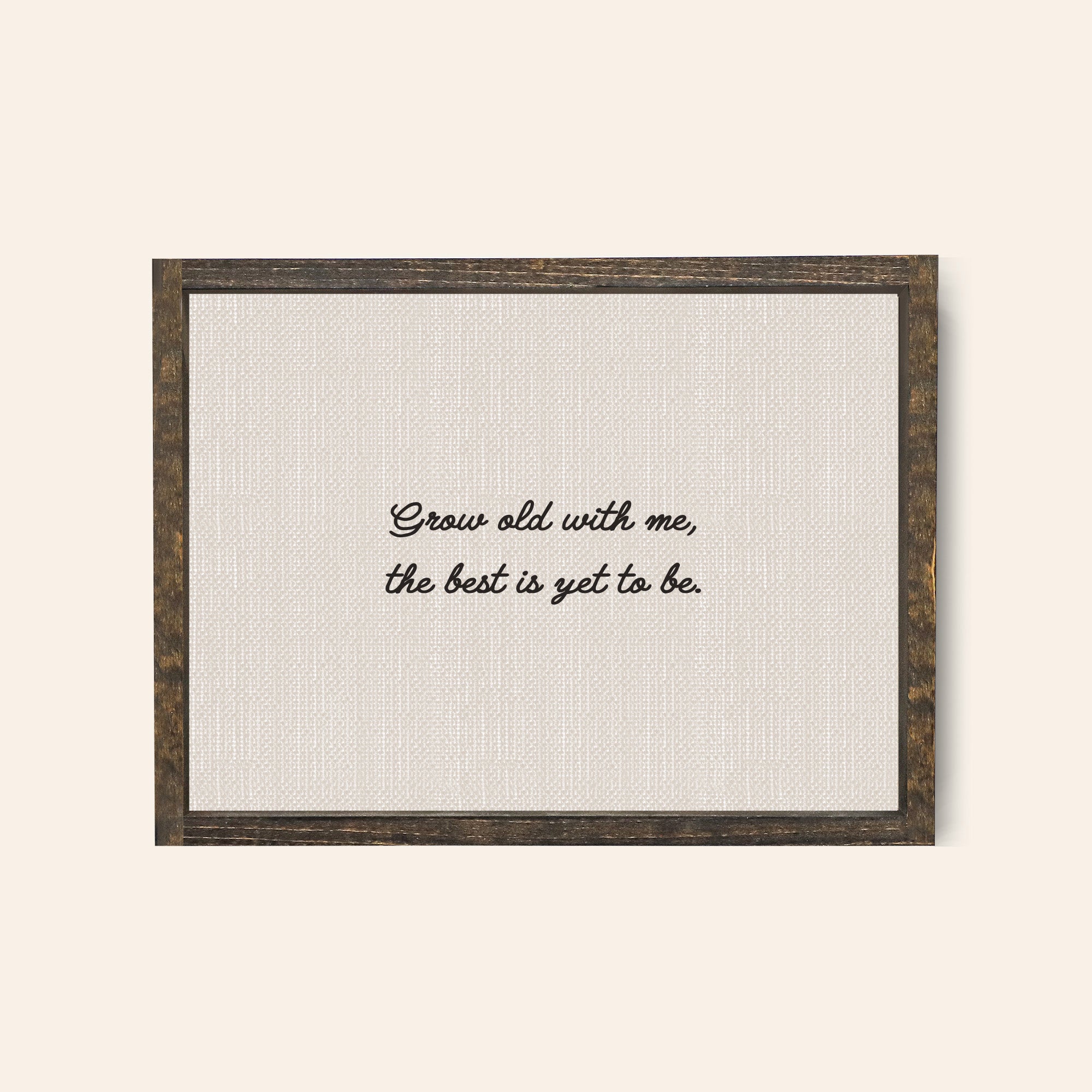 Espresso wood coloured frame with the text in a whimsical handwritten text "grow old with me the best is yet to be"
