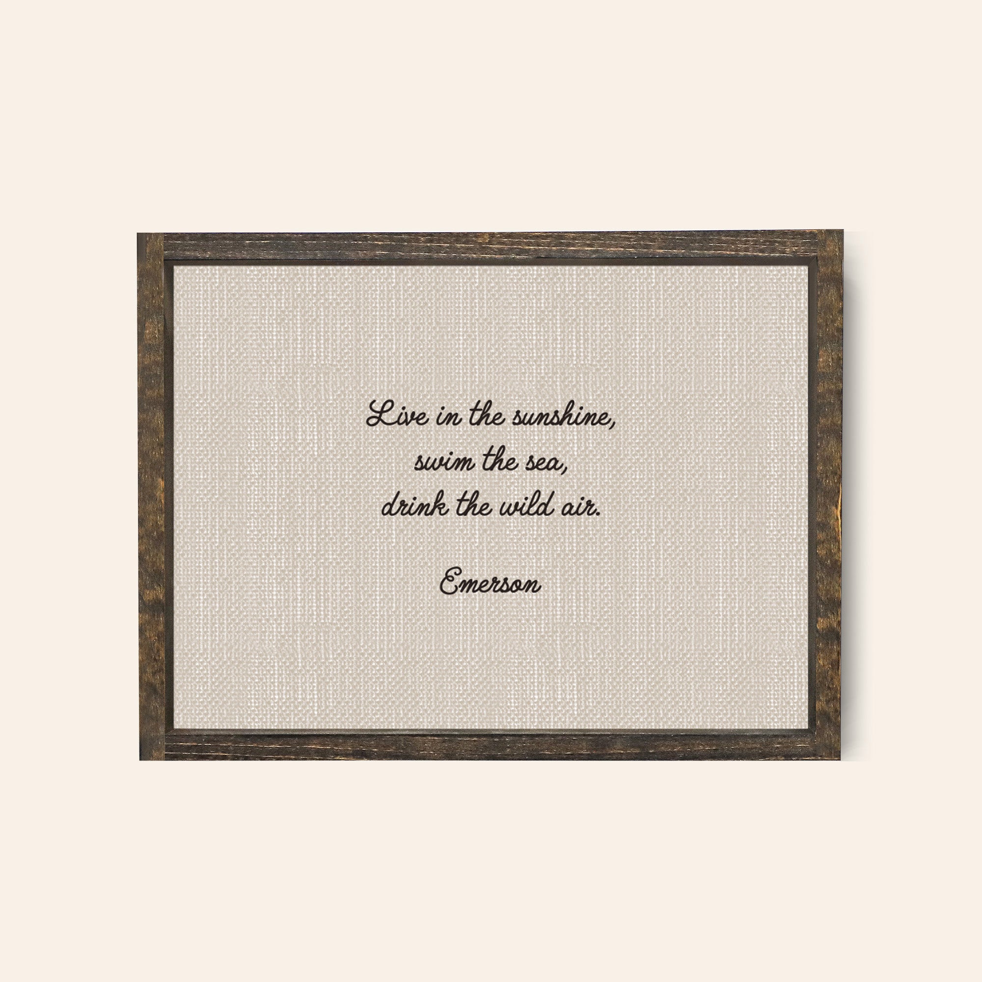 Espresso framed wood sign with the quote, "Live In The Sunshine, swim the sea, drink the wild air, emerson 
