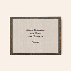 Espresso framed wood sign with the quote, "Live In The Sunshine, swim the sea, drink the wild air, emerson 