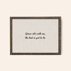 Espresso wood coloured frame with the text in a whimsical handwritten text "grow old with me the best is yet to be"
